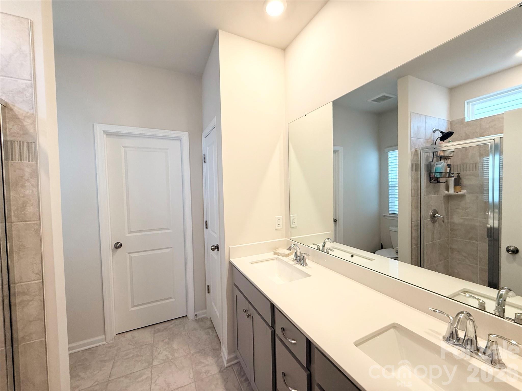 6570 Gopher Road Lancaster, SC 29720 - Photo 15 of 26 a bathroom with a granite countertop sink and a mirror