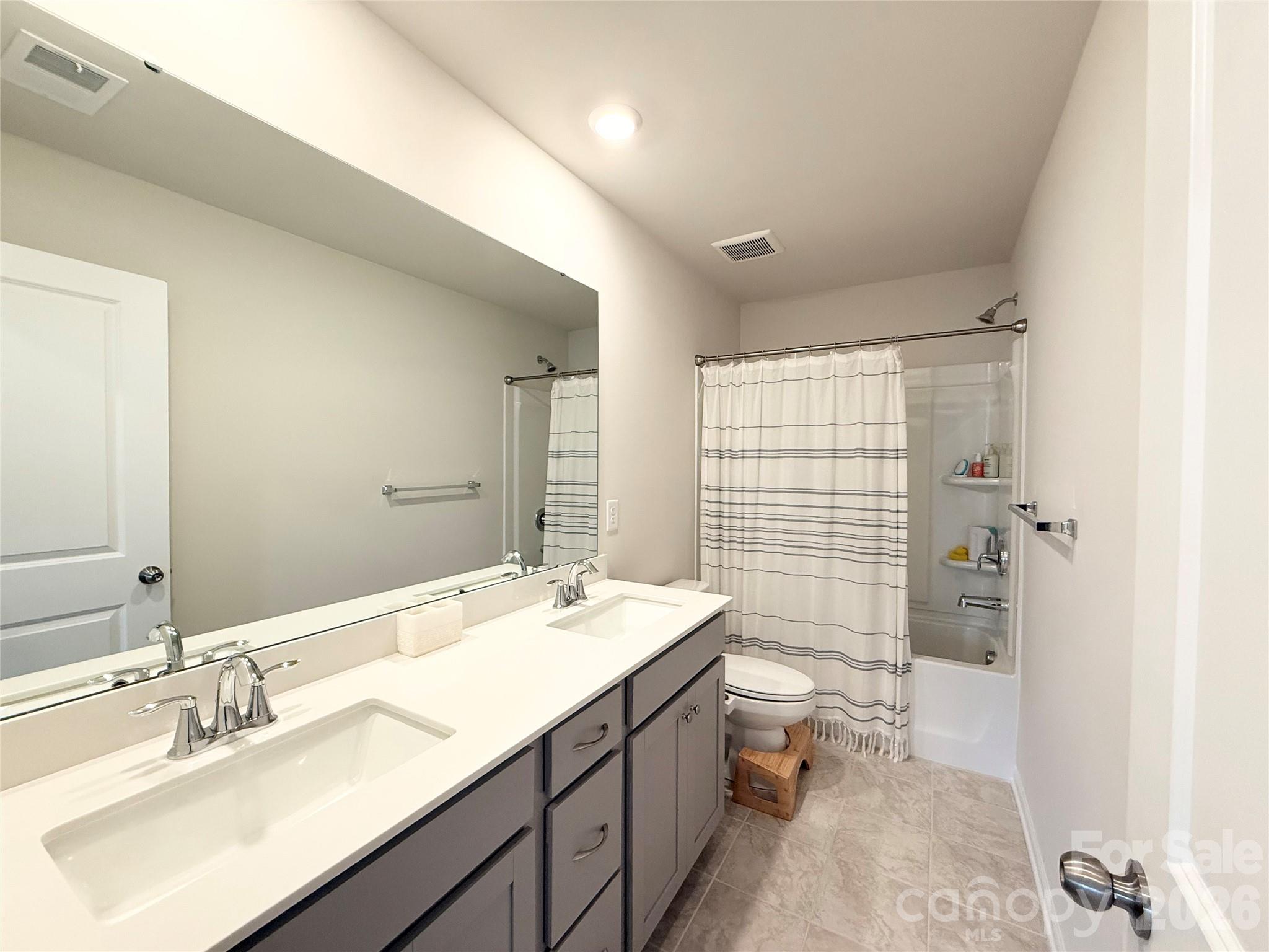 6570 Gopher Road Lancaster, SC 29720 - Photo 17 of 26 a bathroom with a sink double vanity and a bathtub