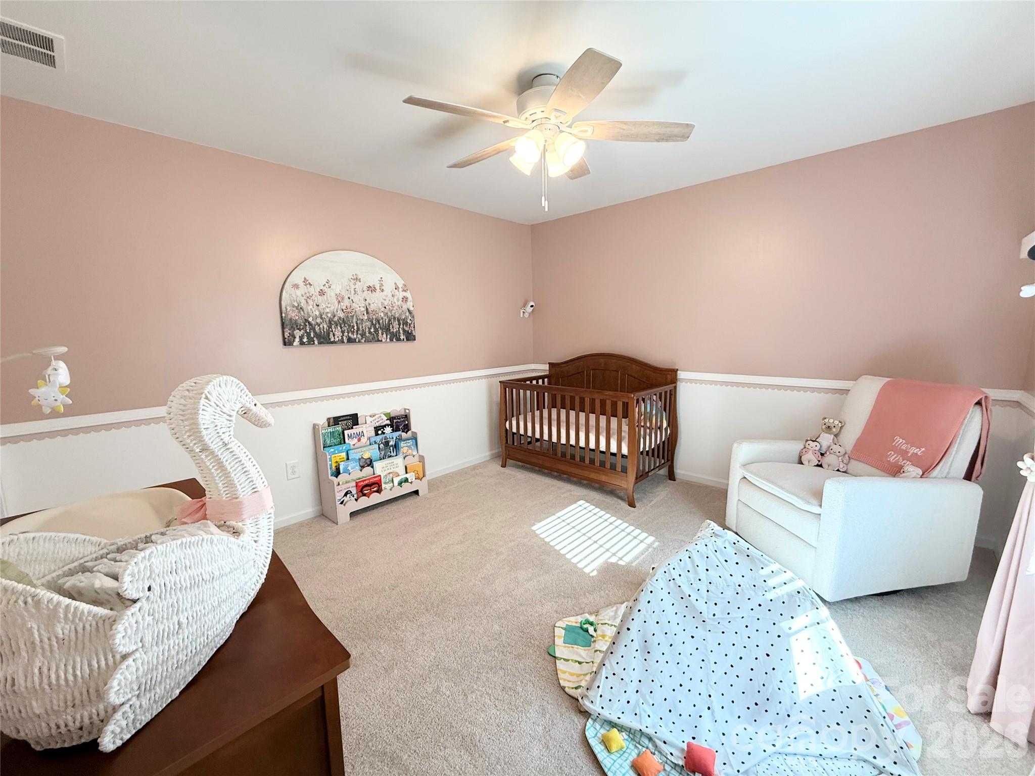 6570 Gopher Road Lancaster, SC 29720 - Photo 18 of 26 a living room with furniture and a baby crib