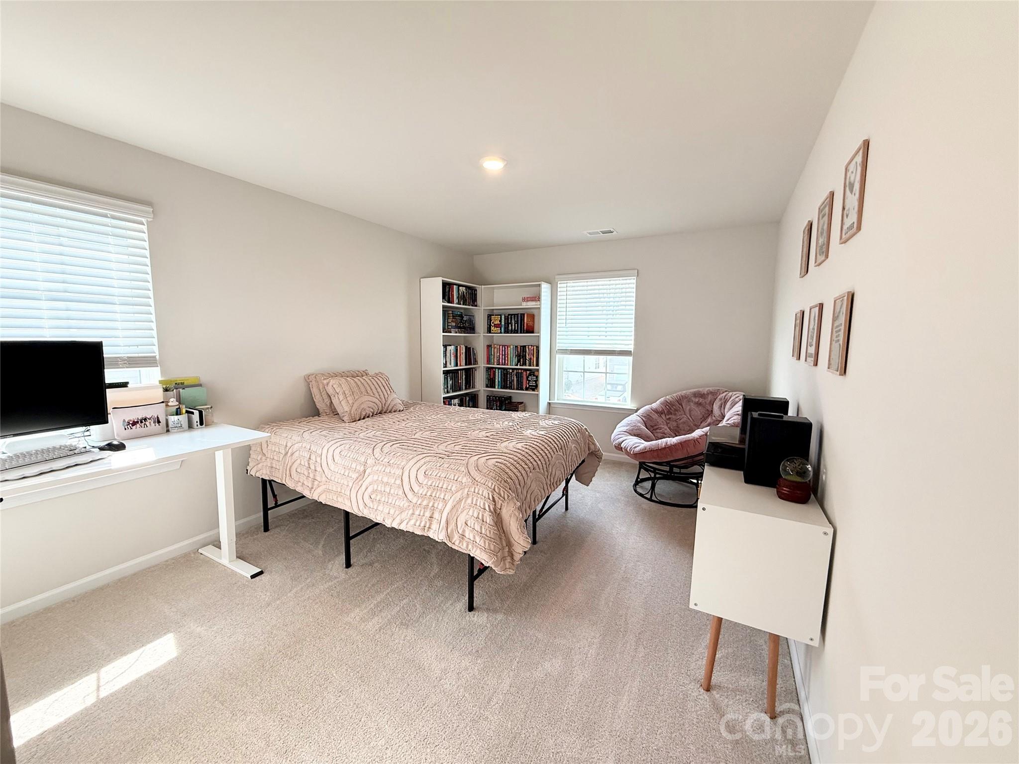 6570 Gopher Road Lancaster, SC 29720 - Photo 21 of 26 a bedroom with a bed and a couch