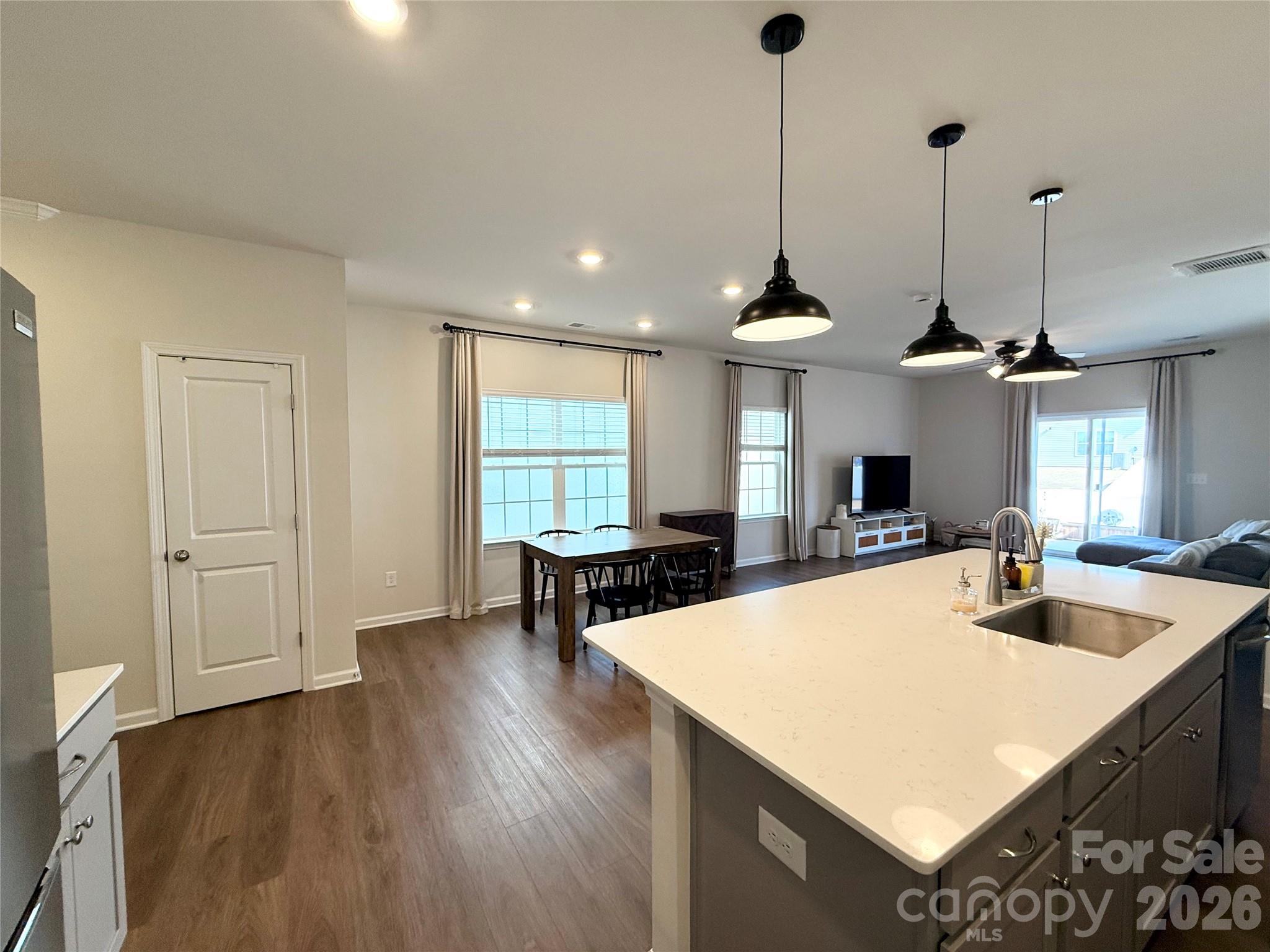 6570 Gopher Road Lancaster, SC 29720 - Photo 5 of 26 a large kitchen with sink a refrigerator and chairs