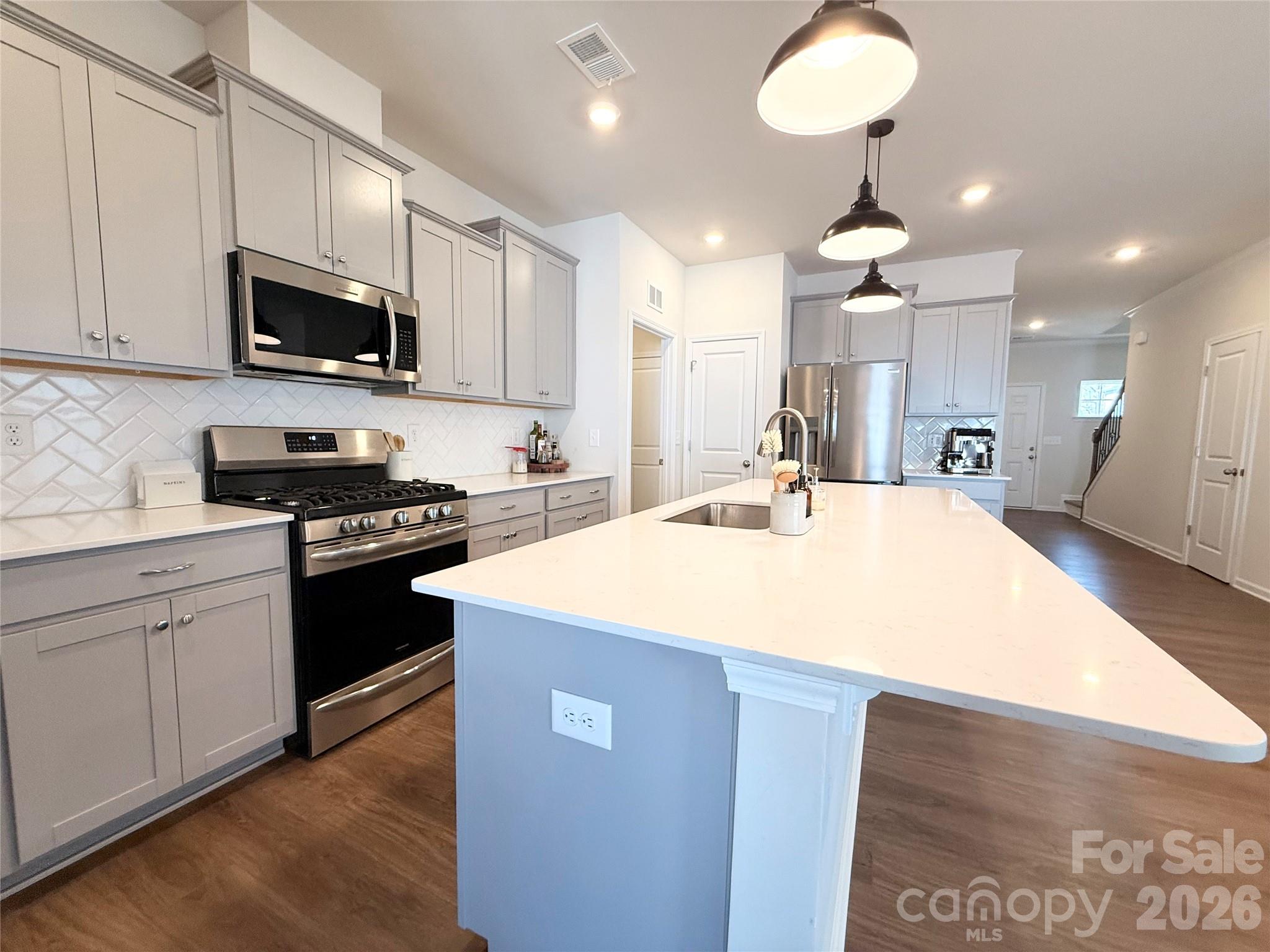 6570 Gopher Road Lancaster, SC 29720 - Photo 9 of 26 a kitchen with a sink stainless steel appliances and cabinets