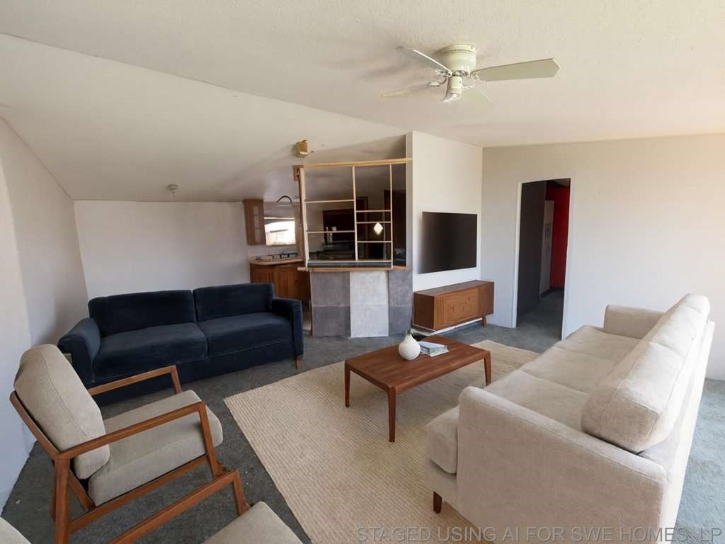 110 Bell Street Bangs, TX 76823 - Photo 3 of 10 a living room with furniture and a flat screen tv