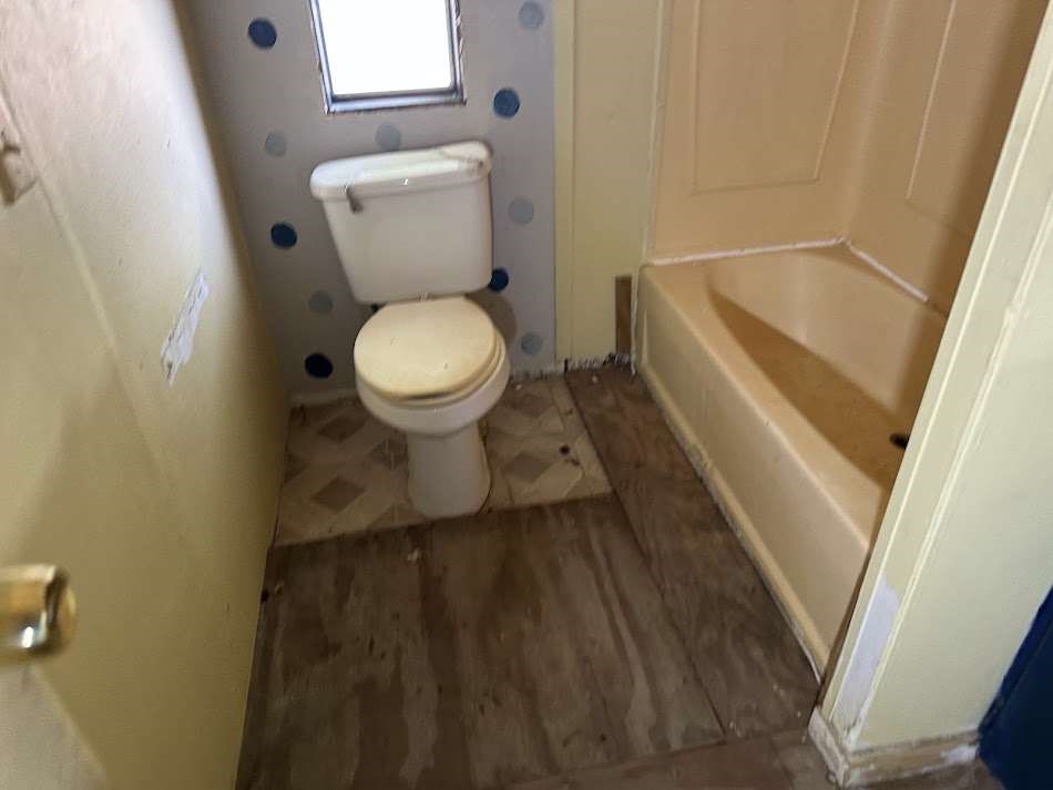 110 Bell Street Bangs, TX 76823 - Photo 7 of 10 a bathroom with a sink and a toilet