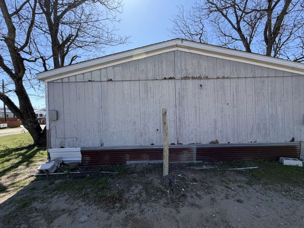 110 Bell Street Bangs, TX 76823 - Photo 9 of 10 a view of a small barn with a small yard