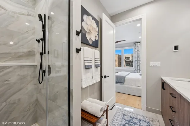 a bathroom with a tub and shower