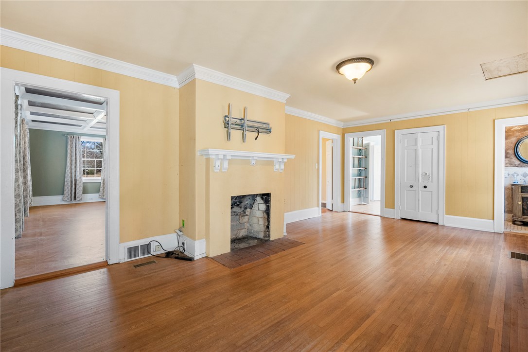 2307 North Avenue Anderson, SC 29625 - Photo 16 of 49 This inviting living space features warm wood flooring and a classic fireplace.