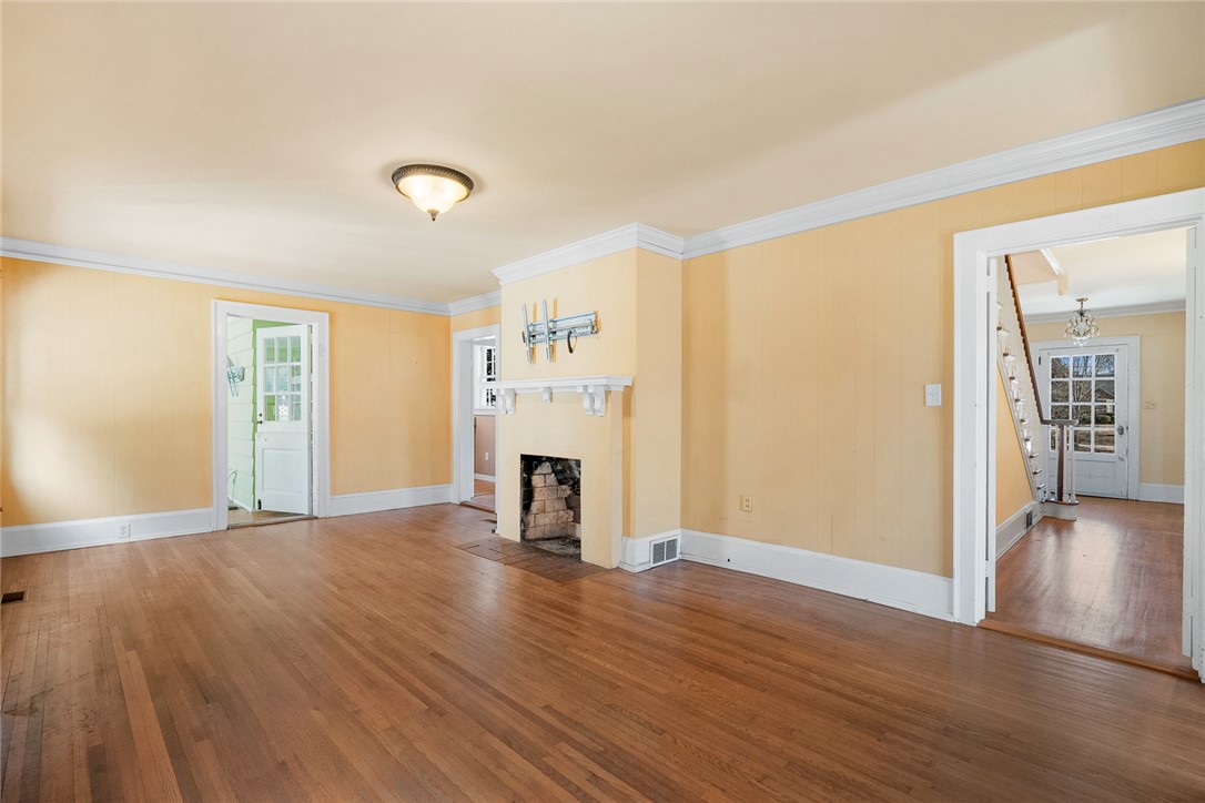 2307 North Avenue Anderson, SC 29625 - Photo 17 of 49 This inviting space features classic hardwood floors and a cozy fireplace, perfect for gatherings.