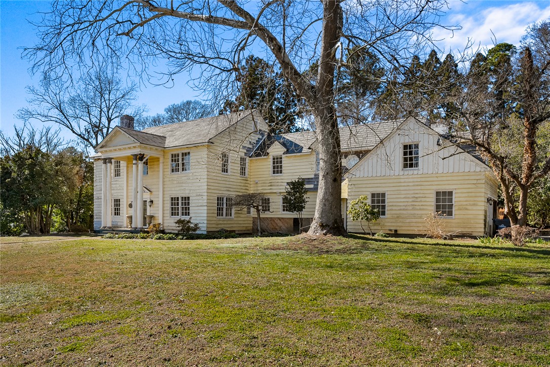 2307 North Avenue Anderson, SC 29625 - Photo 3 of 49 This classic residence features a stately facade and an expansive lawn, offering timeless curb appeal.
