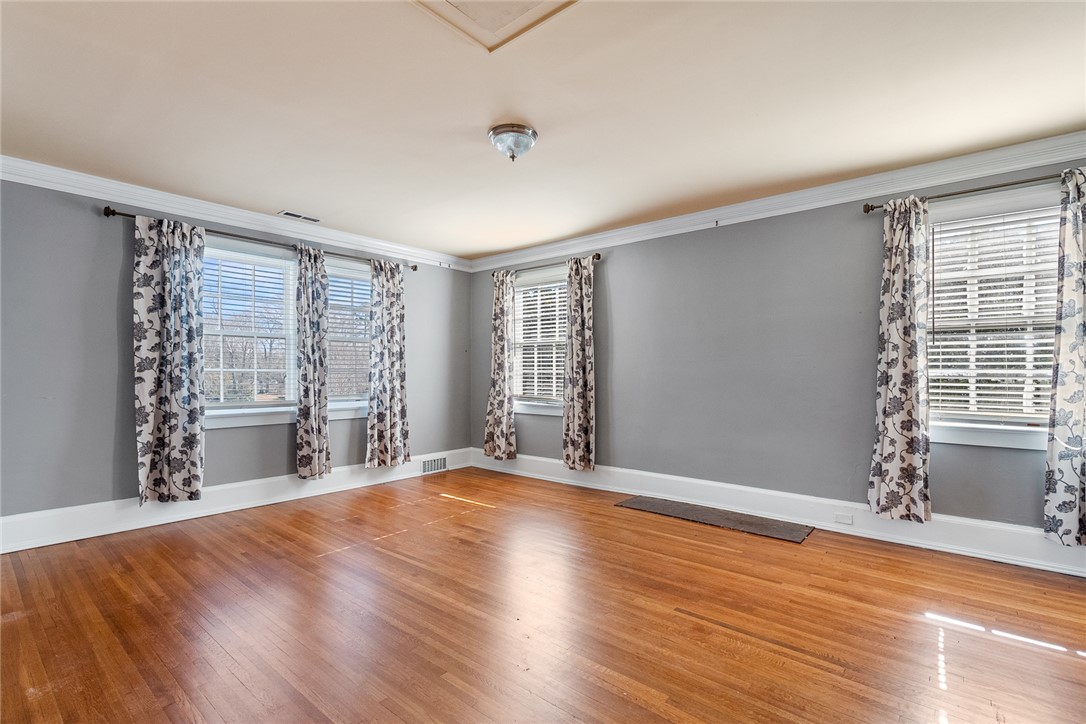 2307 North Avenue Anderson, SC 29625 - Photo 31 of 49 This bright room features beautiful hardwood floors and multiple windows, creating an inviting atmosphere.