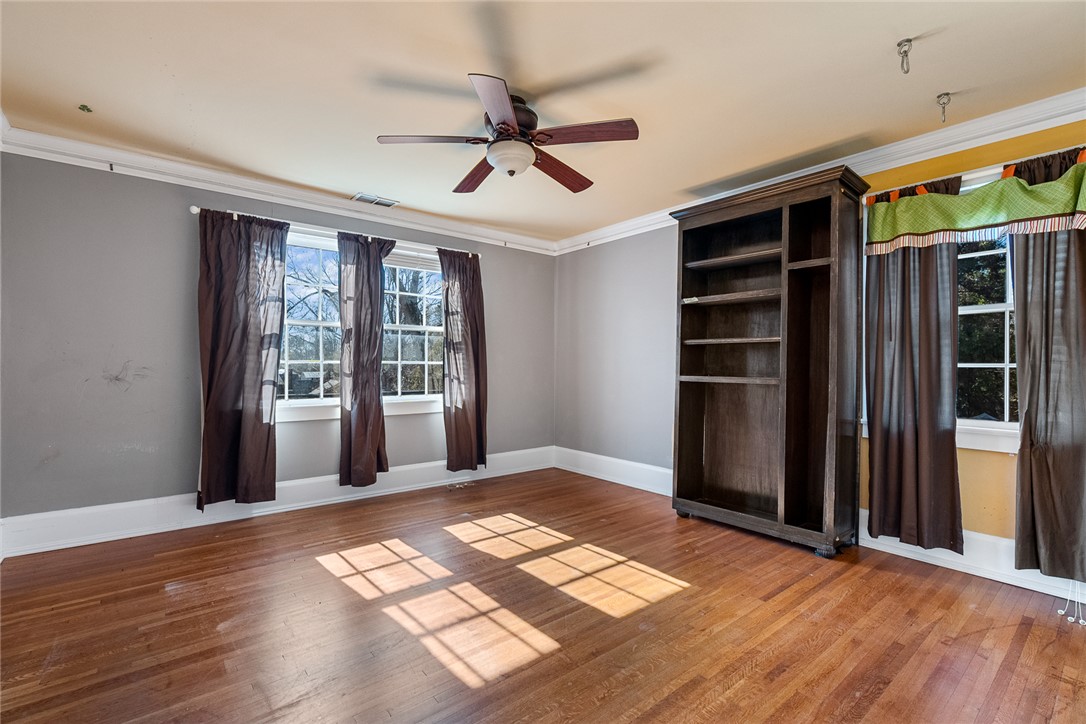 2307 North Avenue Anderson, SC 29625 - Photo 34 of 49 This spacious room features hardwood floors and ample natural light, ideal for a flexible living space.