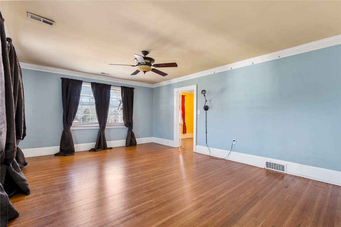 2307 North Avenue Anderson, SC 29625 - Photo 36 of 49 This airy room features hardwood floors and ample natural light, ideal for comfortable living.