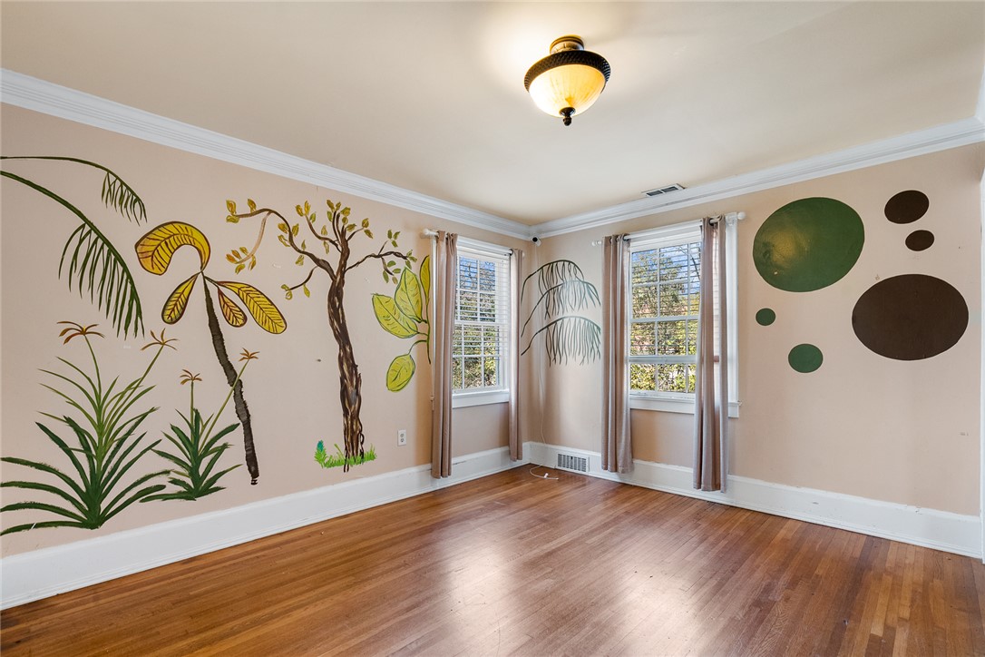 2307 North Avenue Anderson, SC 29625 - Photo 38 of 49 This spacious room features ample natural light and beautiful hardwood flooring.