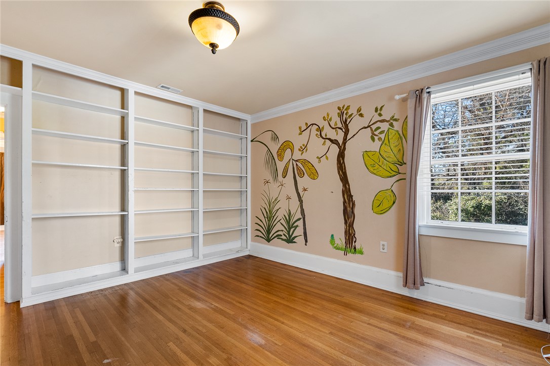 2307 North Avenue Anderson, SC 29625 - Photo 39 of 49 This versatile space features built-in shelving, hardwood flooring, and abundant natural light.