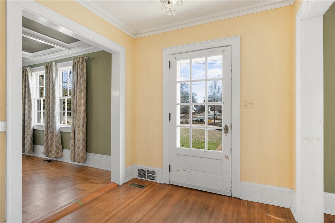 2307 North Avenue Anderson, SC 29625 - Photo 4 of 49 This bright space features elegant hardwood flooring and a classic paneled door.