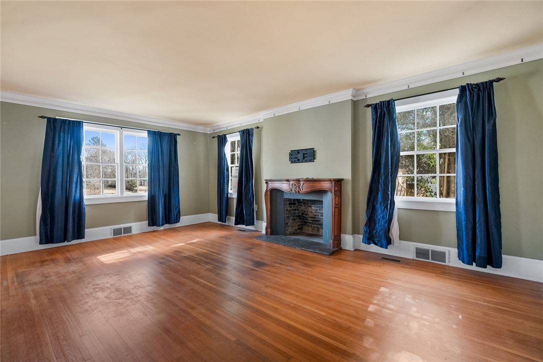 2307 North Avenue Anderson, SC 29625 - Photo 10 of 49 This bright living space features elegant hardwood flooring and a classic fireplace.