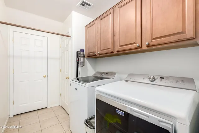 a aerial view of a house with swimming pool garden and patio