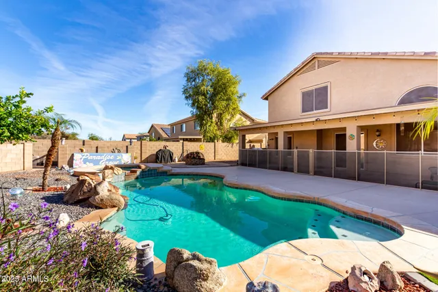 a view of a house with a yard and plants