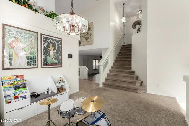a view of a dining room with wooden floor and furniture