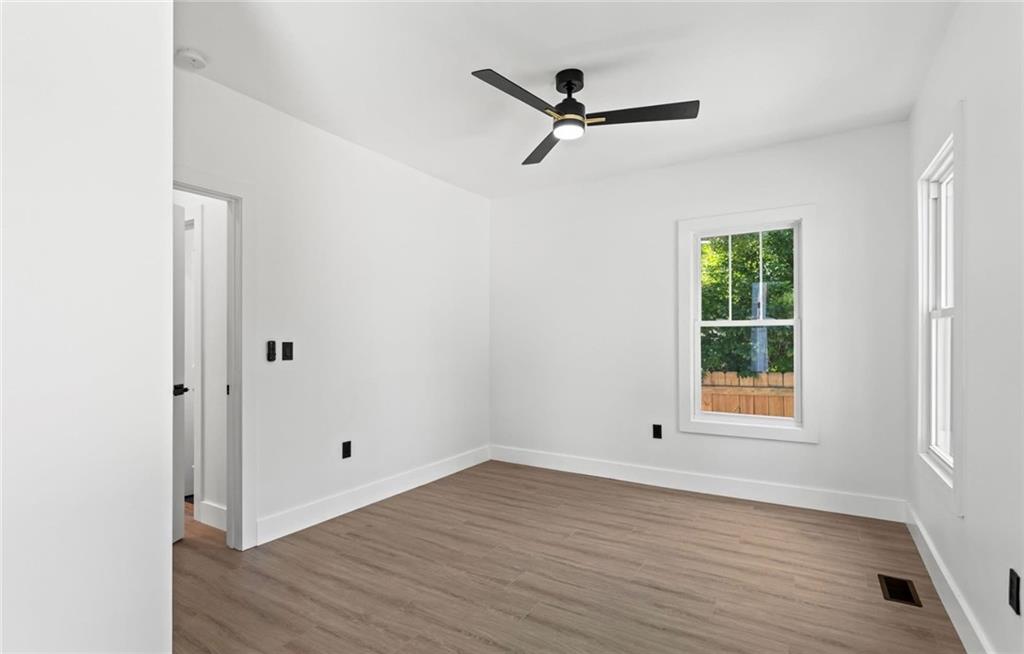 525 Medlock Road Decatur, GA 30030 - Photo 13 of 50 wooden floor in an empty room with a window