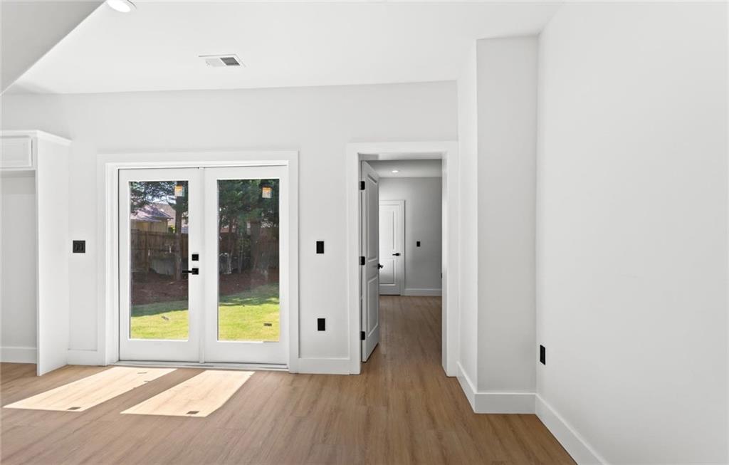 525 Medlock Road Decatur, GA 30030 - Photo 19 of 50 a view of an empty room with glass door