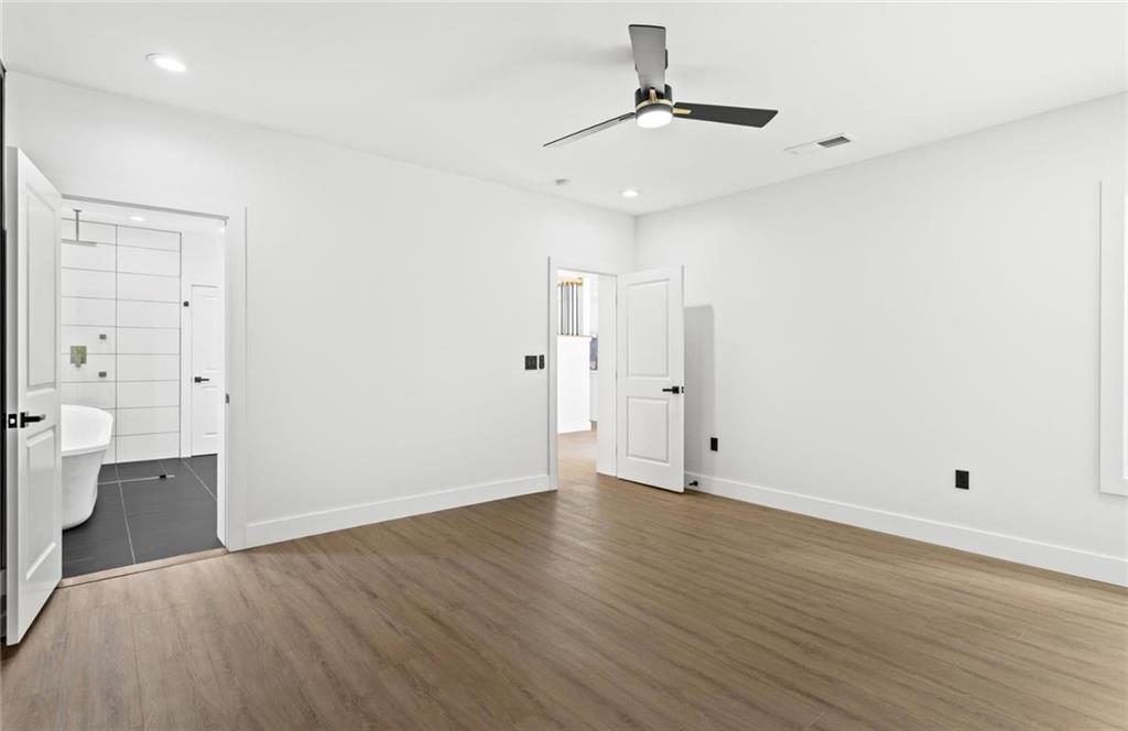 525 Medlock Road Decatur, GA 30030 - Photo 25 of 50 a view of an empty room with wooden floor