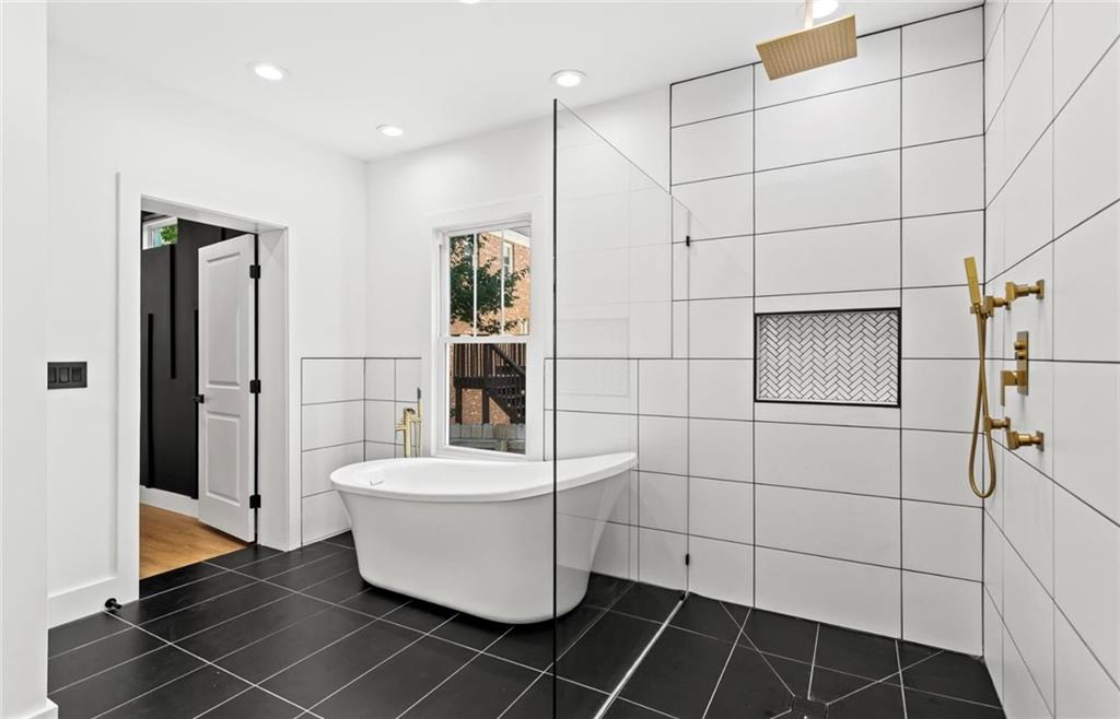 525 Medlock Road Decatur, GA 30030 - Photo 26 of 50 a bathroom with a sink toilet and shower