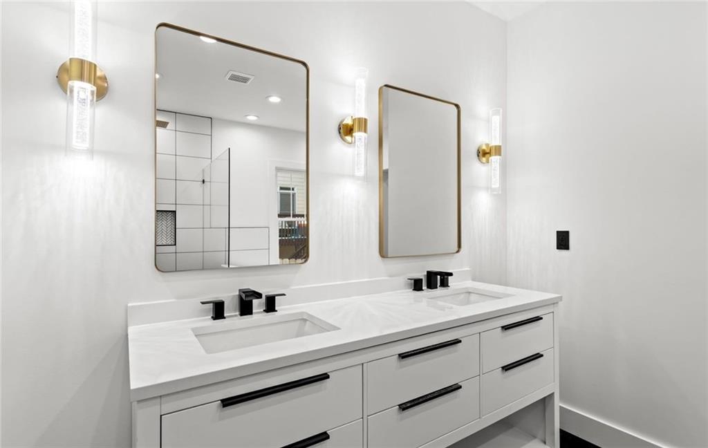 525 Medlock Road Decatur, GA 30030 - Photo 27 of 50 a bathroom with a sink vanity and a mirror
