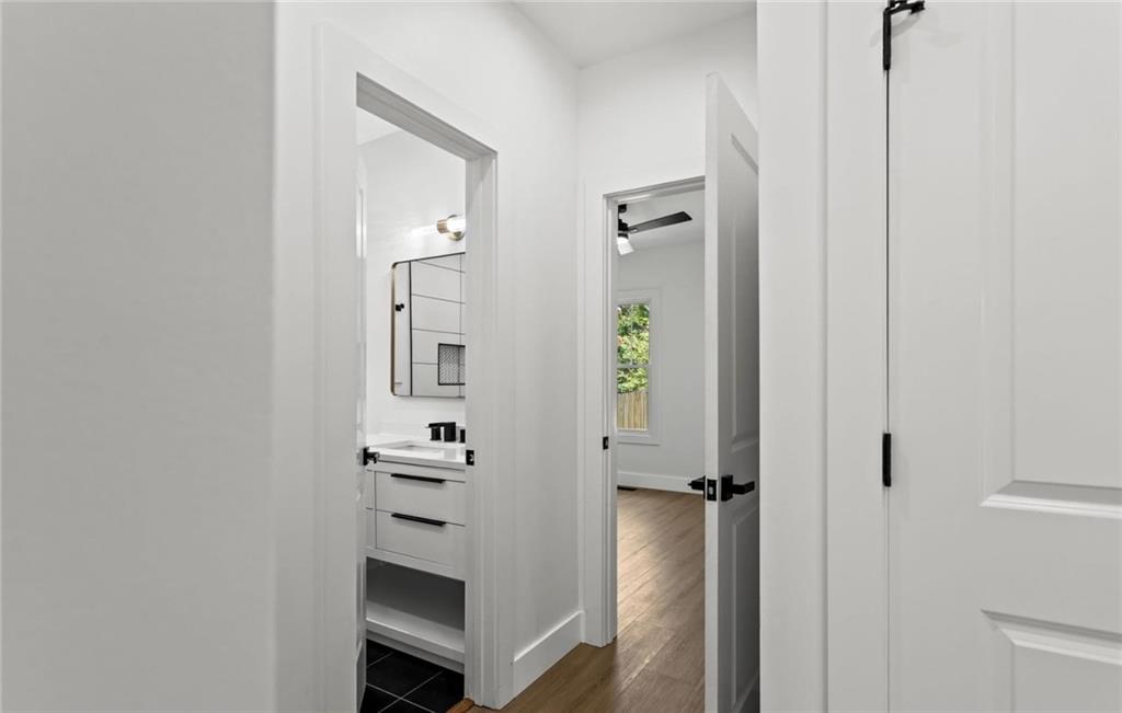 525 Medlock Road Decatur, GA 30030 - Photo 29 of 50 a view of a hallway with wooden floor and staircase