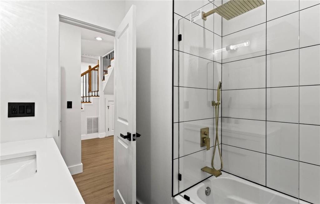 525 Medlock Road Decatur, GA 30030 - Photo 30 of 50 a bathroom with a shower and a glass door