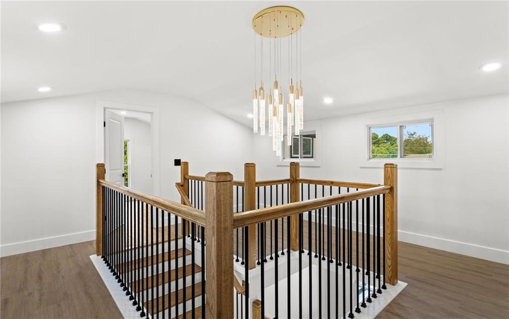 525 Medlock Road Decatur, GA 30030 - Photo 35 of 50 a view of staircase with railing and a chandelier