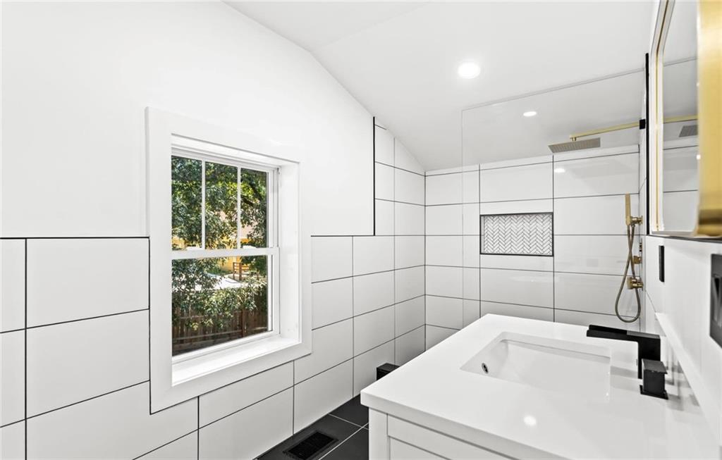 525 Medlock Road Decatur, GA 30030 - Photo 42 of 50 a bathroom with a sink and a shower