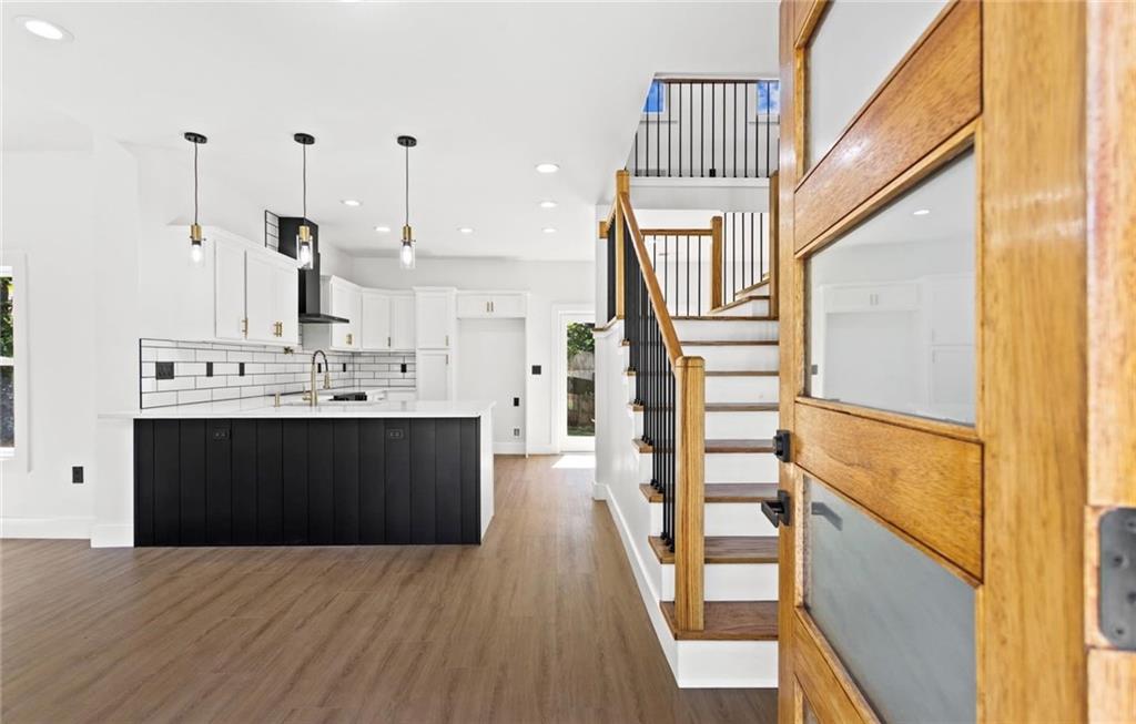 525 Medlock Road Decatur, GA 30030 - Photo 6 of 50 a view of a hallway with wooden floor and staircase