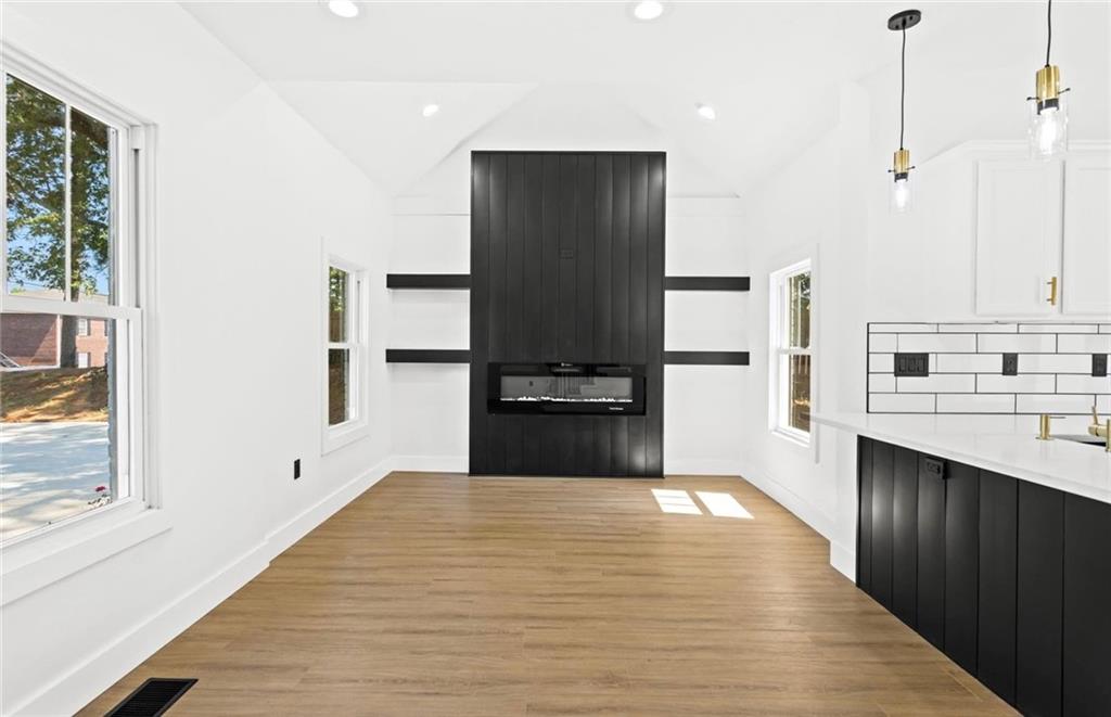 525 Medlock Road Decatur, GA 30030 - Photo 8 of 50 a kitchen with stainless steel appliances kitchen island wooden cabinets and a counter top space
