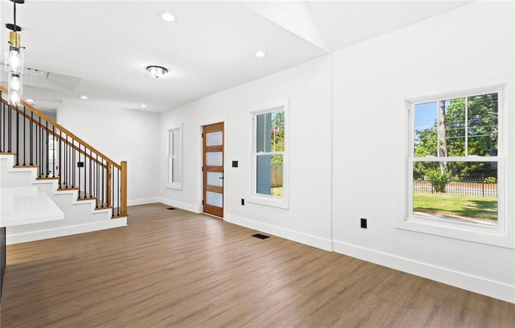 525 Medlock Road Decatur, GA 30030 - Photo 10 of 50 an empty room with wooden floor and windows