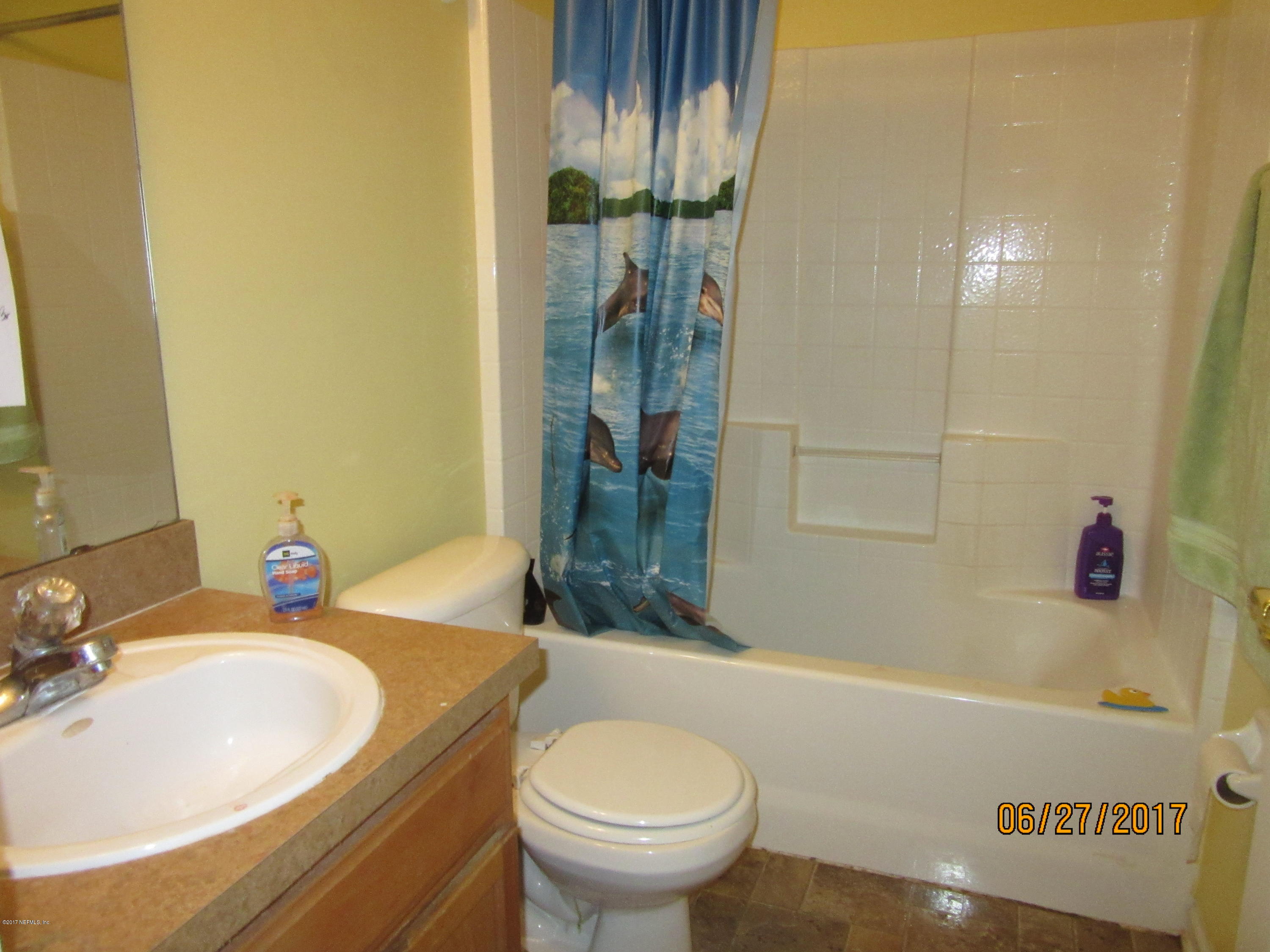 766 East Red House Branch Road St. Augustine, FL 32084 - Photo 12 of 15 a bathroom with a granite countertop sink and a mirror