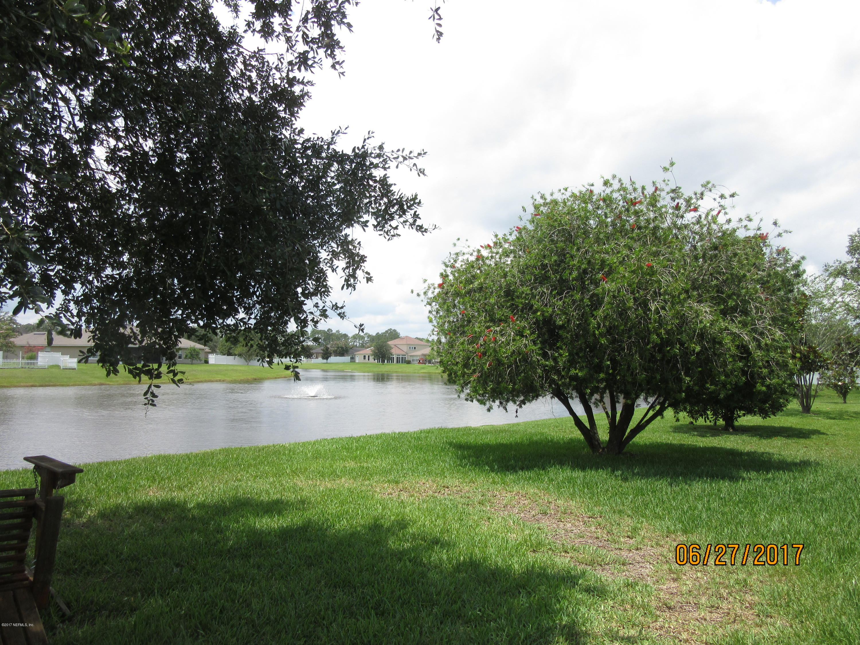 766 East Red House Branch Road St. Augustine, FL 32084 - Photo 15 of 15 a view of outdoor space with deck and trees