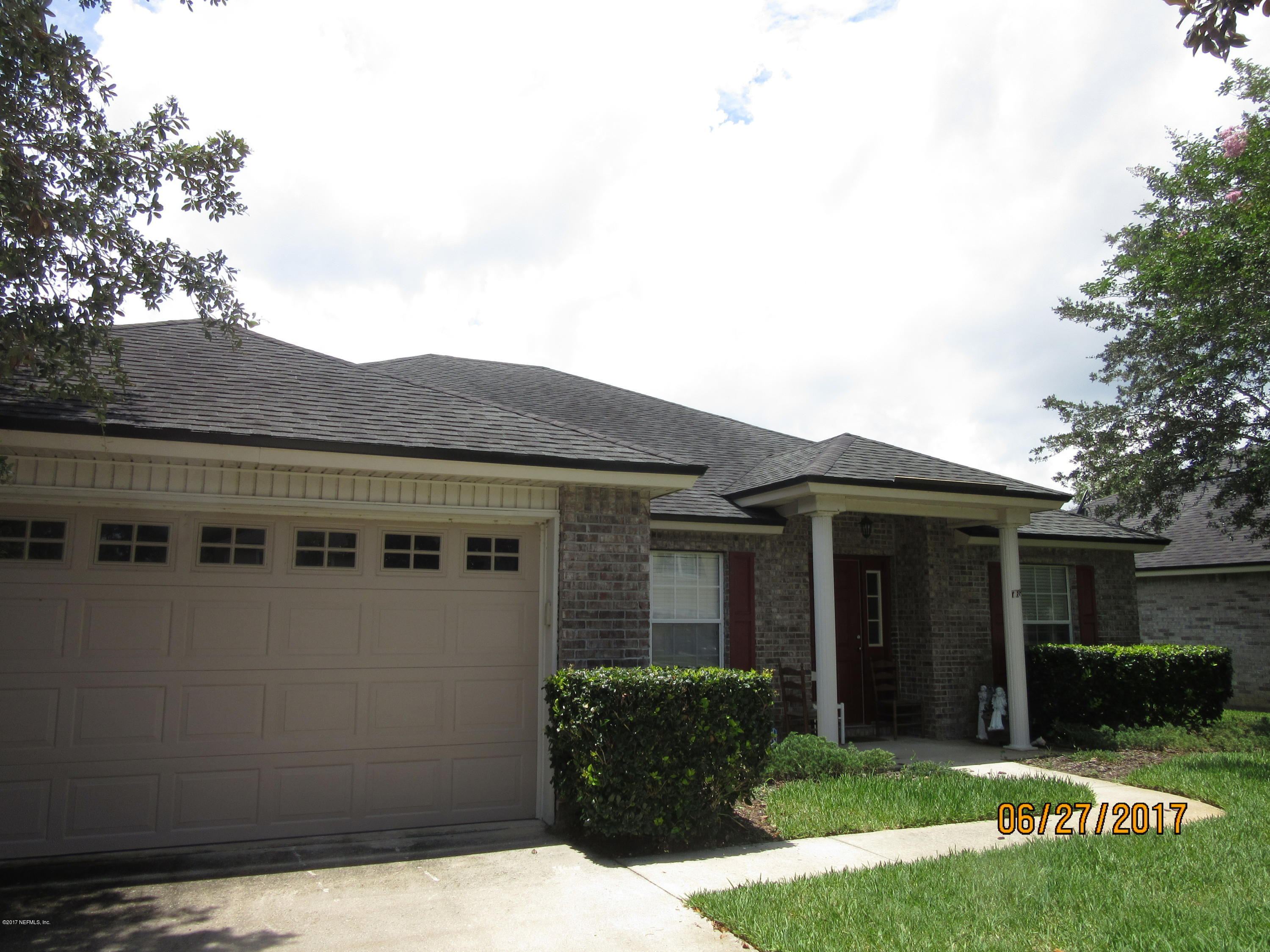 766 East Red House Branch Road St. Augustine, FL 32084 - Photo 2 of 15 front view of a house with a yard