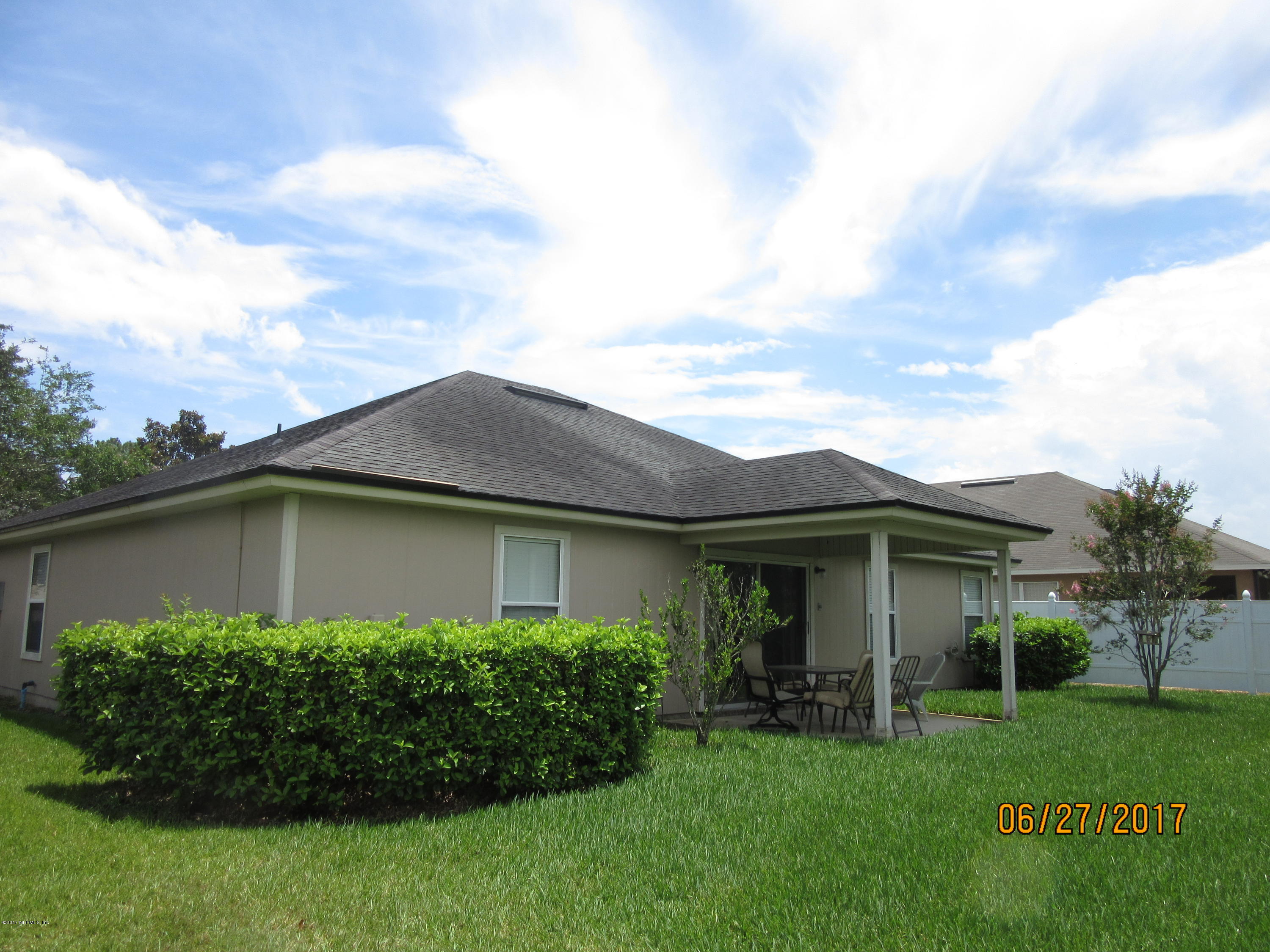 766 East Red House Branch Road St. Augustine, FL 32084 - Photo 3 of 15 a view of a house with garden and yard