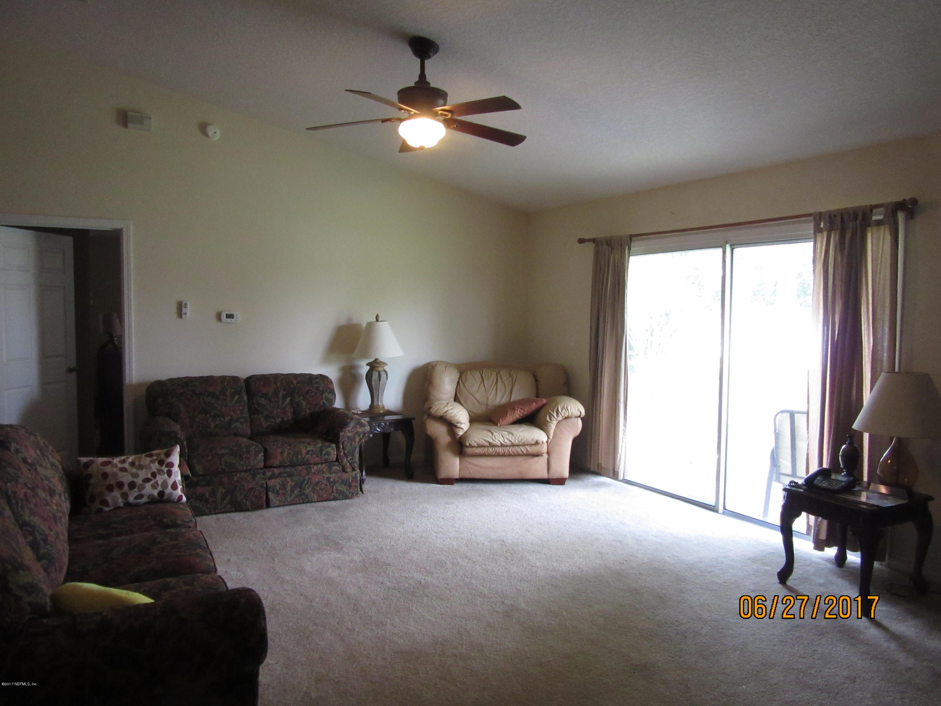 766 East Red House Branch Road St. Augustine, FL 32084 - Photo 7 of 15 a living room with furniture and a window