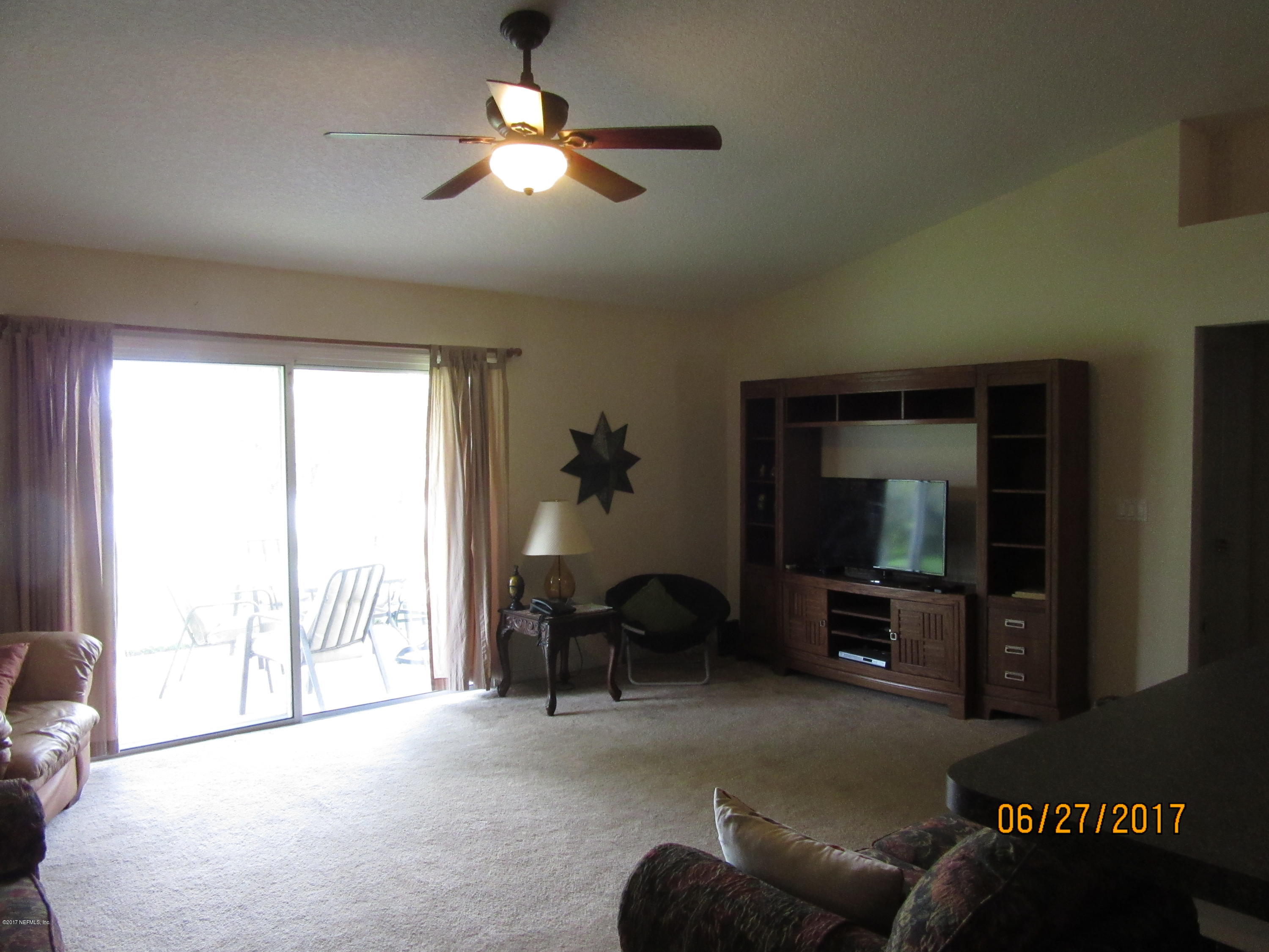 766 East Red House Branch Road St. Augustine, FL 32084 - Photo 8 of 15 a living room with furniture and a flat screen tv
