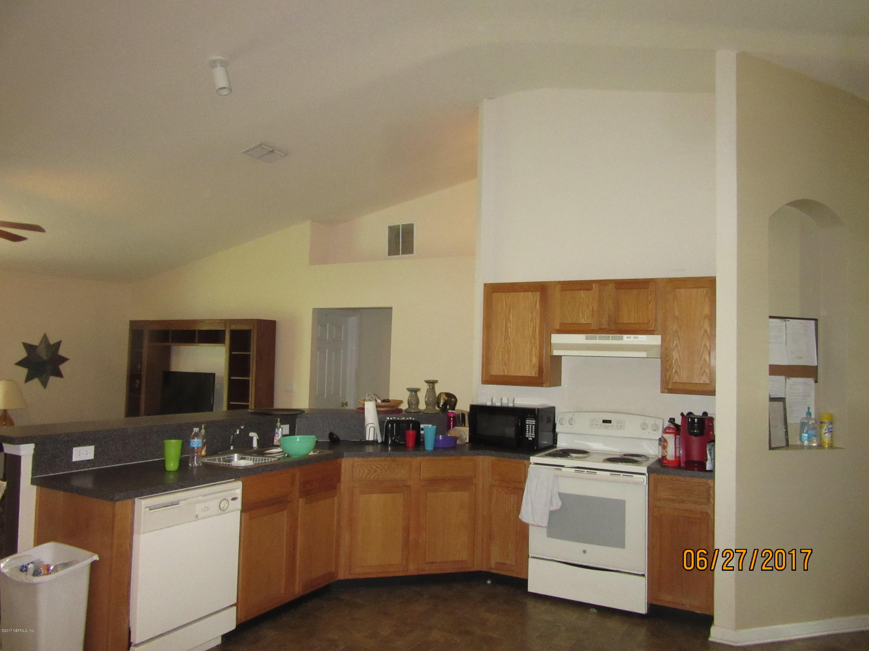 766 East Red House Branch Road St. Augustine, FL 32084 - Photo 9 of 15 a kitchen with sink and cabinets
