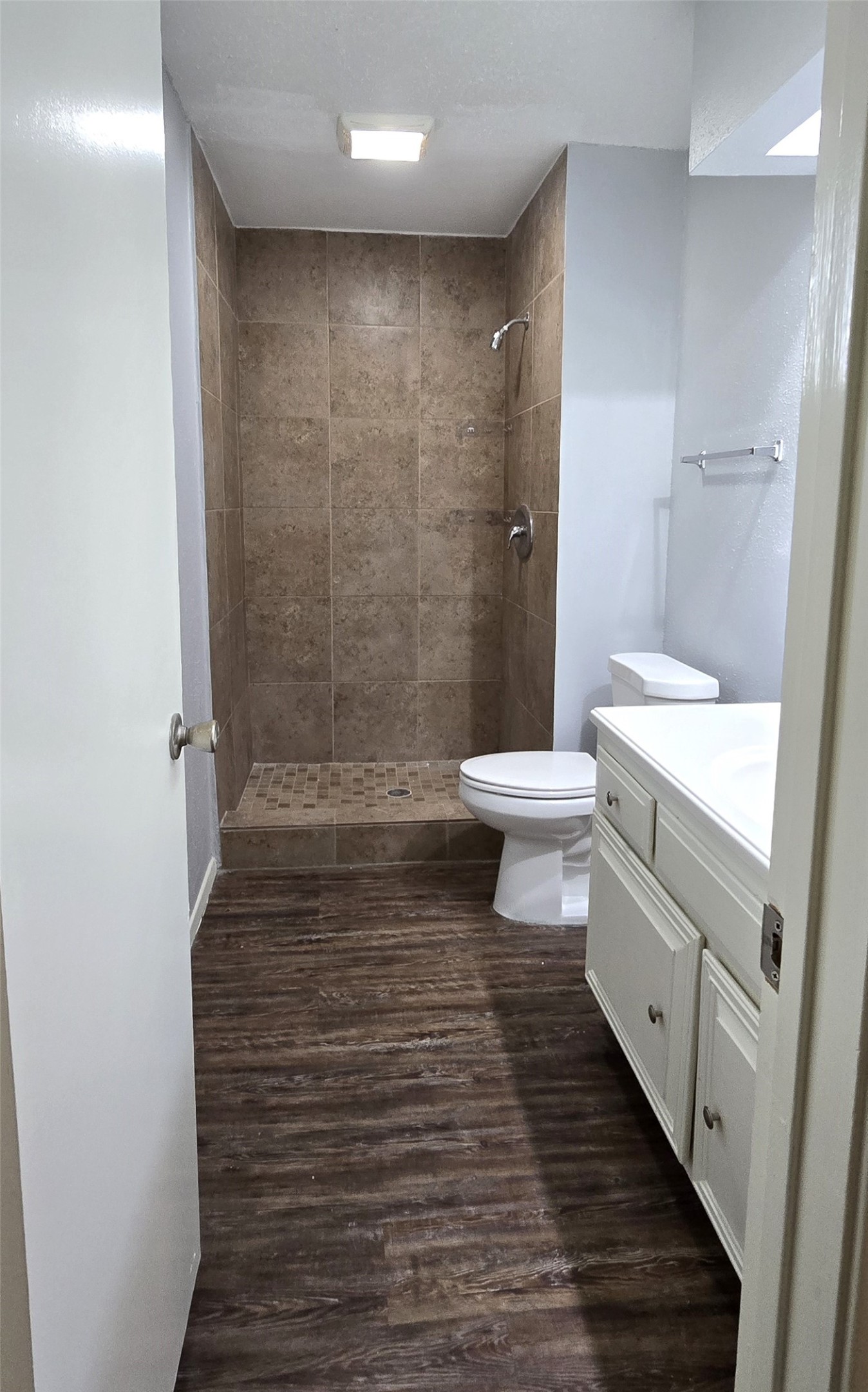 23019 Tree Bright Lane Spring, TX 77373 - Photo 18 of 20 Primary bathroom includes a large walk-in shower detailed with ceramic tiles. Small window viewing into the backyard on the left.