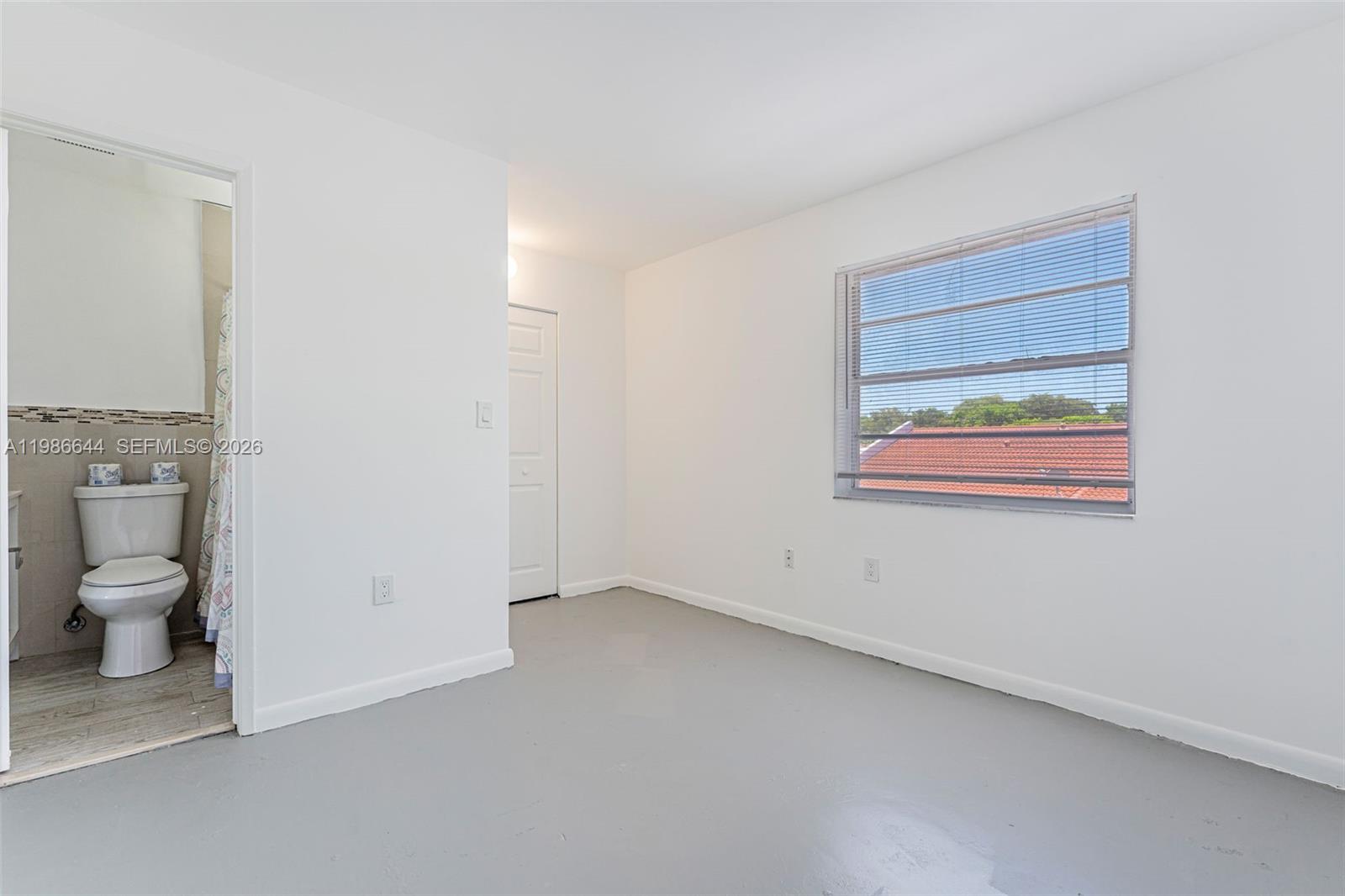 15260 Southwest 80th Street, Unit 10 Miami, FL 33193 - Photo 20 of 27 a view of an empty room with a empty space