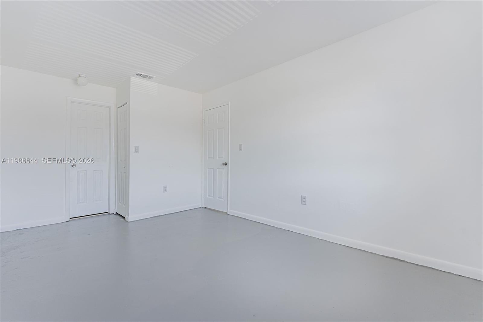 15260 Southwest 80th Street, Unit 10 Miami, FL 33193 - Photo 23 of 27 an empty room with an empty room