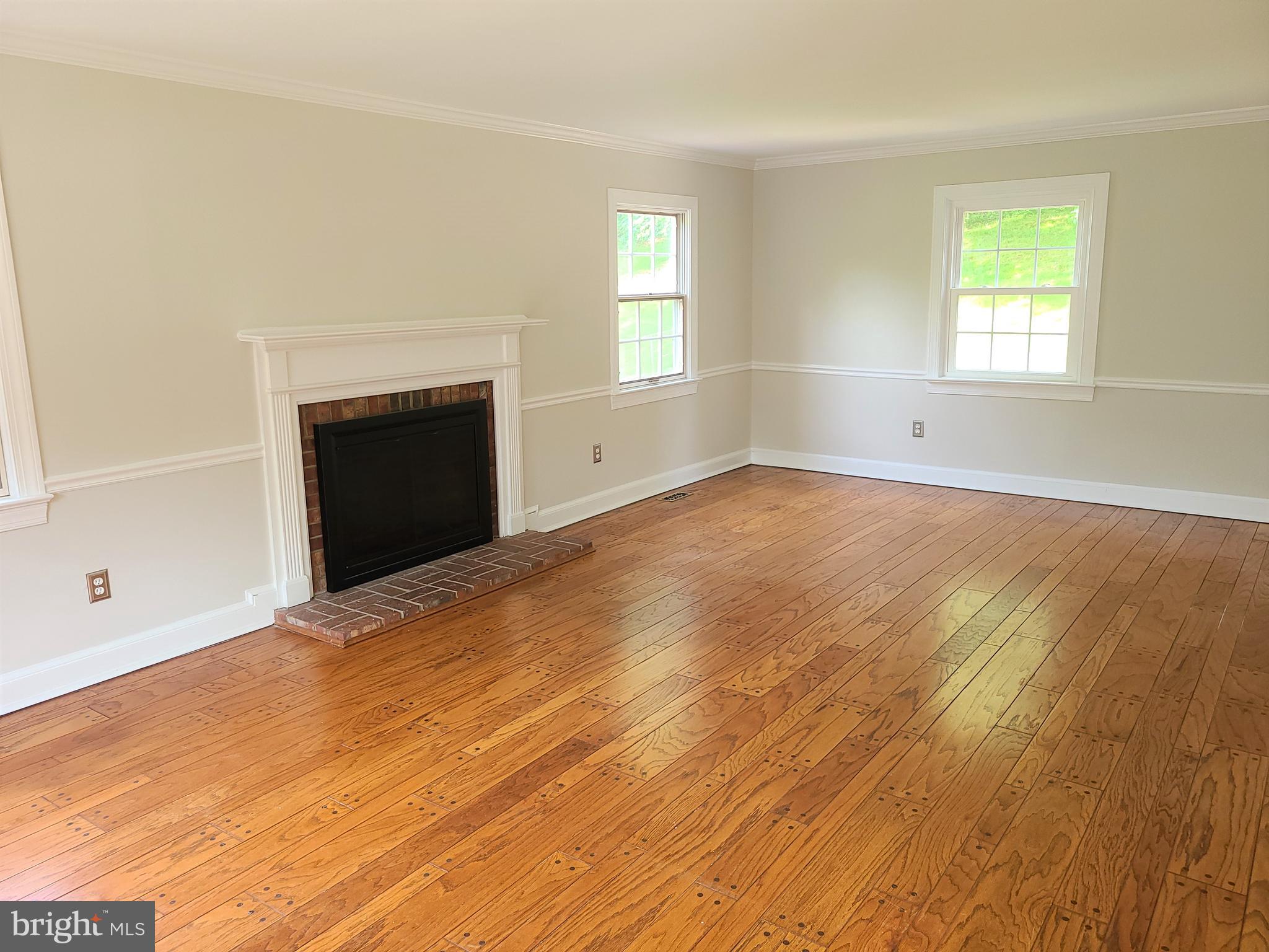 8708 Oxwell Lane Laurel, MD 20708 - Photo 3 of 18 Living Room w/Wood Burning Fireplace