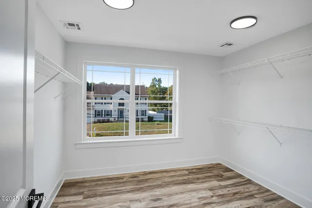 a bathroom with a shower sink and mirror