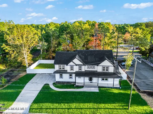 a view of house with garden space and street view