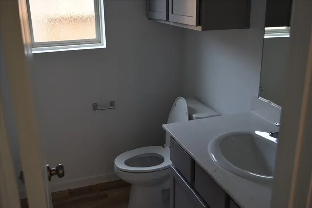 a bathroom with a toilet and sink