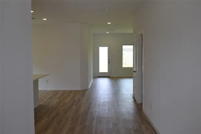 a view of gallery with wooden floor